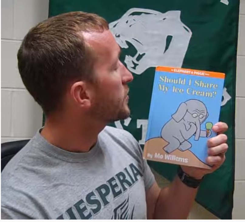 Teacher reads a book